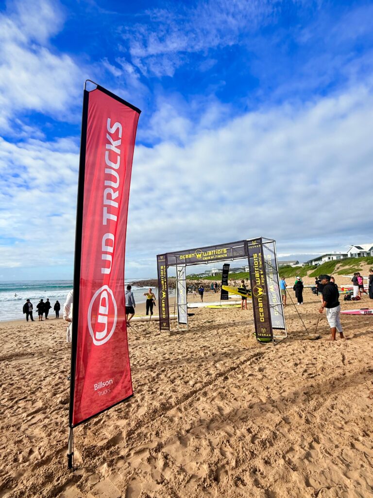 UD Trucks and Ocean Warriors flags at Cape St Francis beach