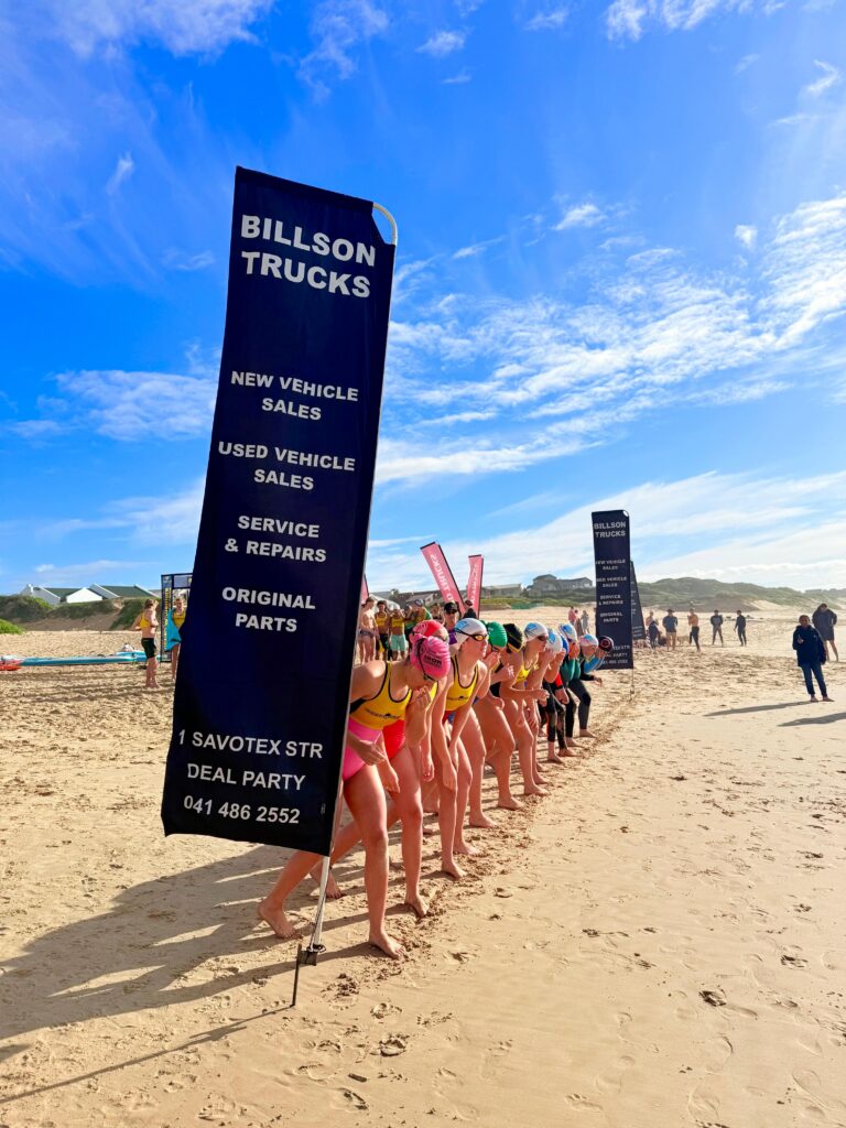 Young Ocean Warriors lifesavers line up on the beach at Cape St Francis